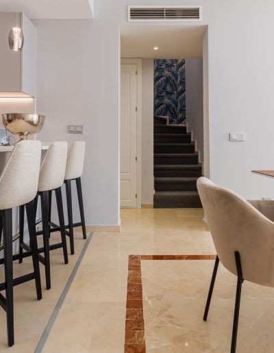 After: bar stools and staircase view