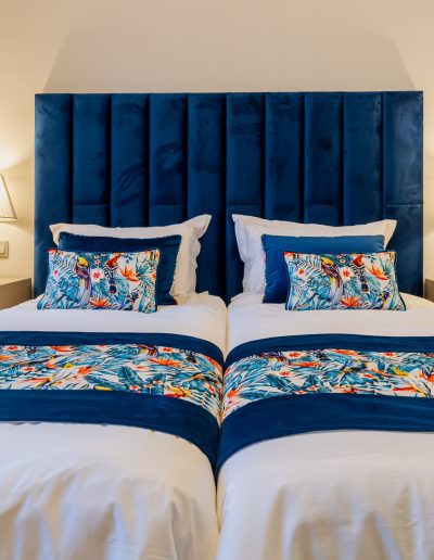 After: twin beds with patterned throws