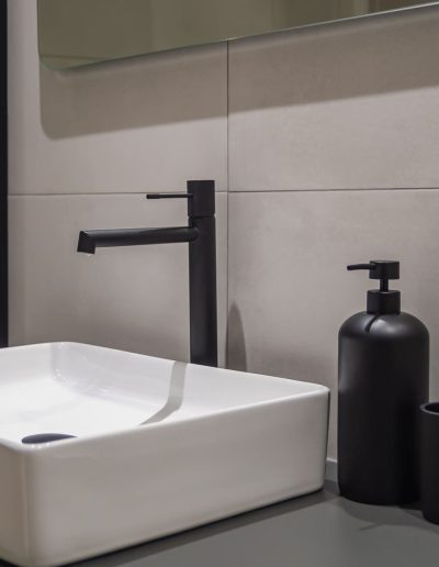 After: modern basin with black tap