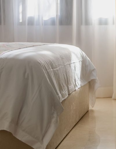 After: bright bedroom with soft linens