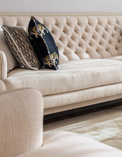 After: tufted sofa with accent cushions