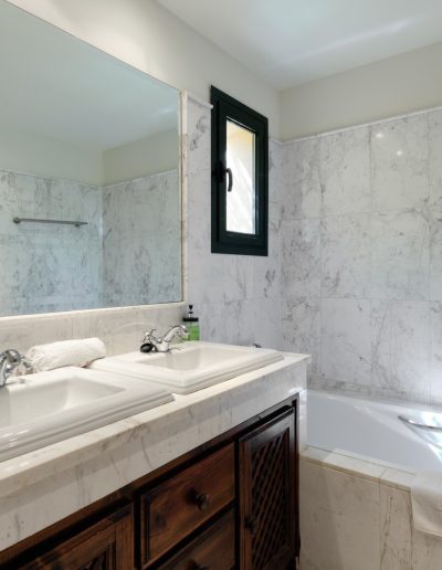 Before: marble bathroom with double sink